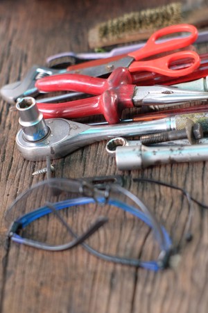 Top view old working tools on wooden background.の写真素材