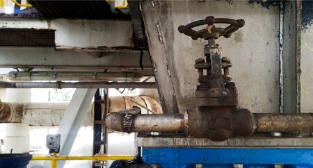 Valves and electric equipment dirty affect from dust and heat  environment  in old factoryの写真素材