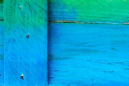 Blue and green painted wooden boardの写真素材