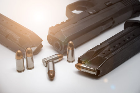 9 mm Pistol, bullets and magazine on white background. Gun isolated