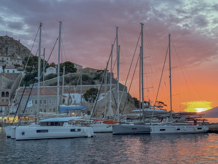 Boats in the harbor at sunsetの写真素材