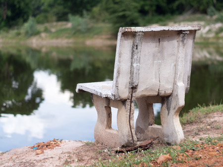 concrete chair by the poolの写真素材