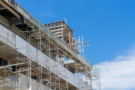 Multi floors building construction for apartment or condominium with bright sky
