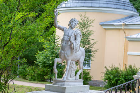 St. Petersburg, Russia - july 10, 2019: sculpture of a centaur against the backdrop of a pavilion and trees in a park, St. Petersburg. High quality photoの写真素材