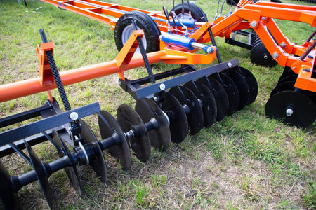 Russia, Leningrad Region - June, 2019: Working bodies of equipment for land cultivation. Agricultural machinery.のeditorial素材