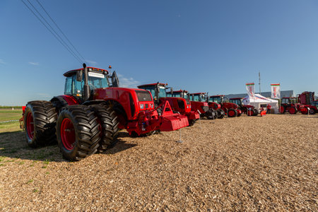 Russia, Republic of Tatarstan, Kazan - July, 2022: Red modern powerful Belarus tractors. New models of agricultural machinery.のeditorial素材