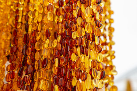 Amber Beads in a Street Shop. Orange Baltic Sea Souvenir, Natural Jewelry, Gold Brown Stone Necklaceの写真素材