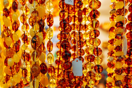 Amber Beads in a Street Shop. Orange Baltic Sea Souvenir, Natural Jewelry, Gold Brown Stone Necklaceの写真素材