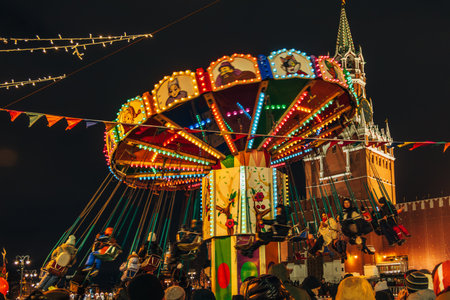 Moscow, Russia - January 2, 2022: Festive carousel on Red Square against the background of St. Basils Cathedralのeditorial素材