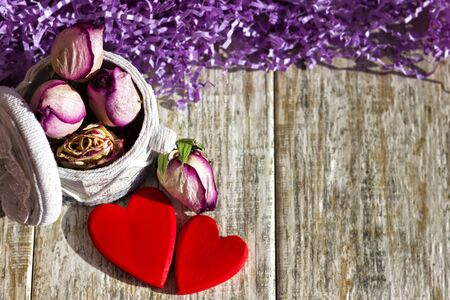 Two bright hearts on a wooden backgroundの写真素材