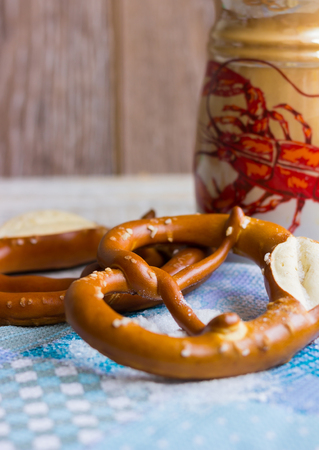 Bavarian pretzels on a blue waffle towelの写真素材