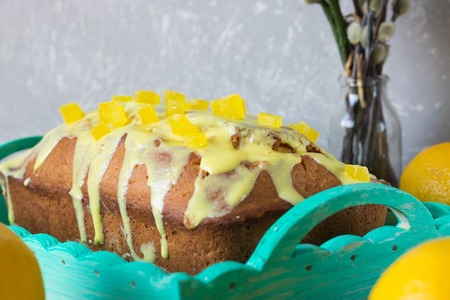 Lemon cake with lemon glaze and candied fruitの写真素材