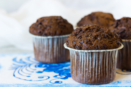 Chocolate muffins on the board written under gzhelの写真素材
