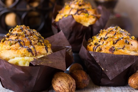 Crafting muffins with pistachios and chocolateの写真素材