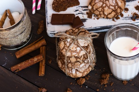 Chocolate biscuits with cracks on a dark wooden backgroundの写真素材