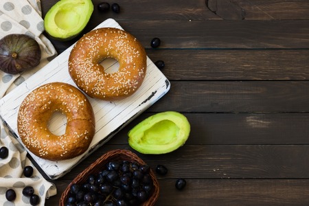 Bagels with fig and banana on curd cheese for breakfastの写真素材