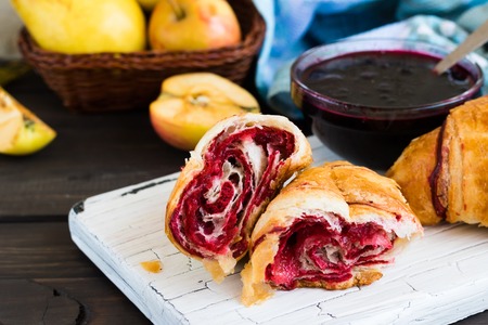 Croissants with jam on a light backgroundの写真素材