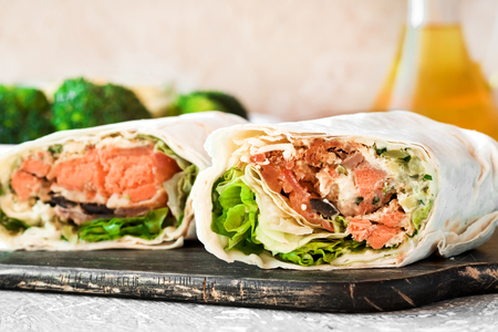 Rolls with salmon and greens in pita breadの写真素材