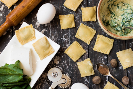 The process of making ravioli with ricotta, spinach and nutmegの写真素材