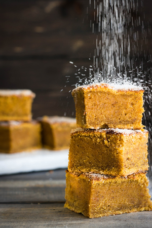 Homemade pumpkin bars with sugar-cinnamon crust for the holiday and for every dayの写真素材