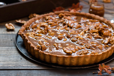 Tarte with salted caramel and walnutsの写真素材