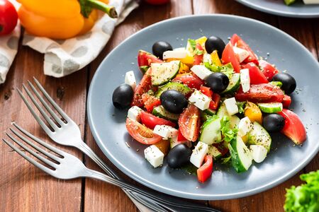 Greek salad with fresh vegetables as a concept of healthy and healthy snackの写真素材
