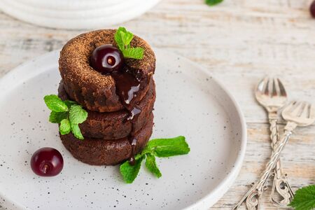 Chocolate fondant - a traditional french chocolate cake with liquid filling. Chocolate Lava Cakeの写真素材
