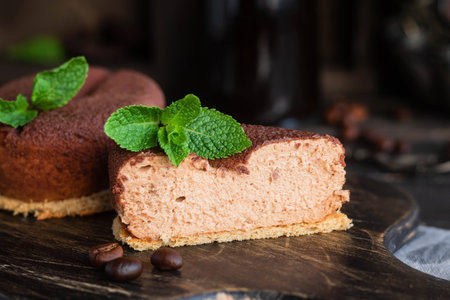 Chocolate and coffee cake on a biscuit pillow in the shape of a coffee bean