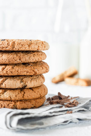Classic pastries. Traditional oatmeal cookies with pieces of chocolate.