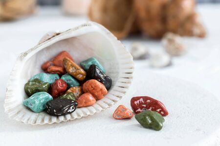 Fancy sweets. Chocolates in the form of sea pebbles. A treat for tea.の写真素材