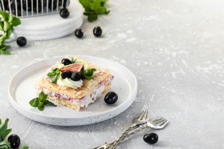 Pavlova on a biscuit with a gentle curd cream, figs and grapes. A new variation of the classic...