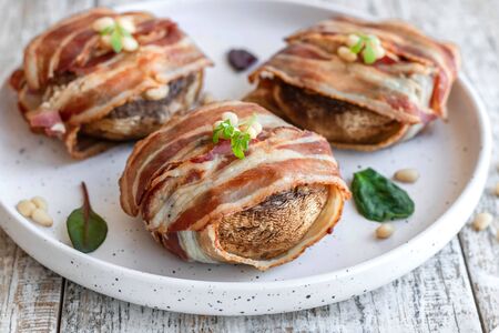 Baked mushrooms stuffed with cheese and pine nutsの写真素材