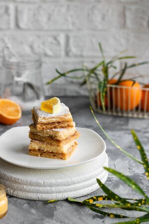 Lemon bars on a shortcrust pastry. A simple dessert for the summerの写真素材