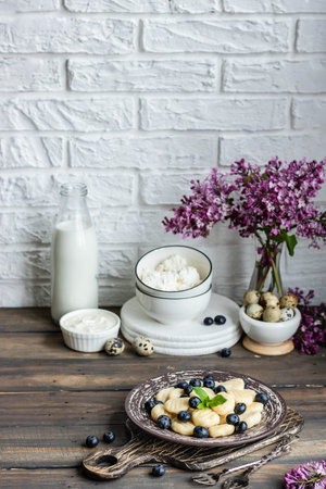 Lazy cottage cheese dumplings with fresh berry. Simple and healthy breakfastの写真素材