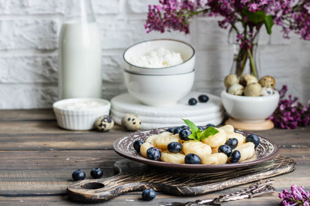 Lazy cottage cheese dumplings with fresh berry. Simple and healthy breakfastの写真素材