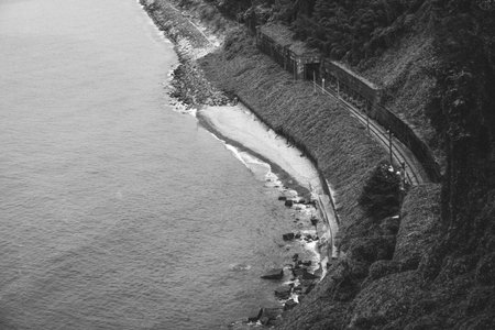 Railway tracks near the sea. High quality black and white photoの写真素材