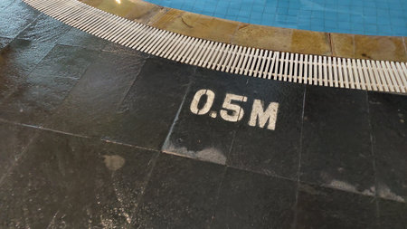 Swimming pool depth indicator. Stone floor.