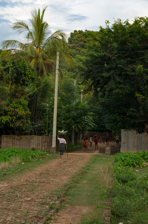 Mrauk-u, Rakhine State / Myanmar - October 18 2016: local people on a village pathのeditorial素材