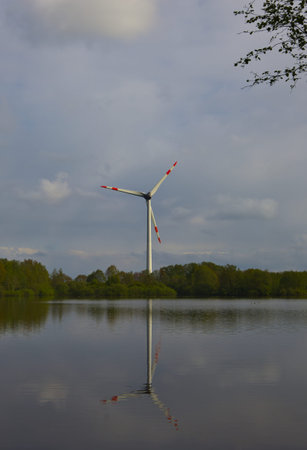 An image of windturbine on a lake in the Netherlands