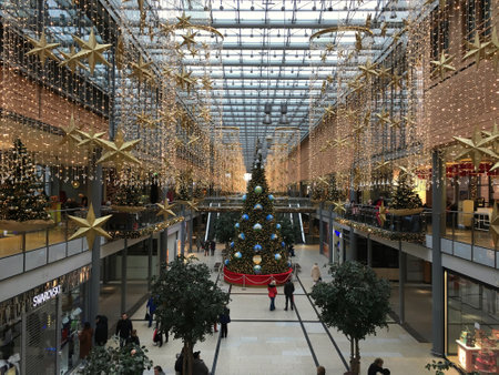 Berlin, Germany - December 2nd, 2018: Potsdamer Platz Arkaden Shopping Mall in Christmas Decoration with huge Christmas Tree, Garlands and Lights.のeditorial素材