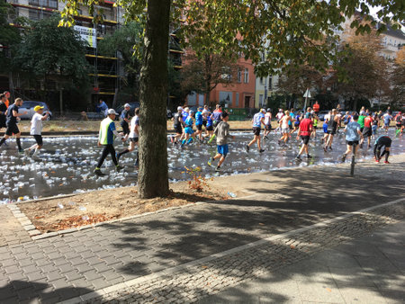 Berlin, Germany - September 16, 2018: People running at Berlin Marathon over tons of Empty Plastic Cupsのeditorial素材