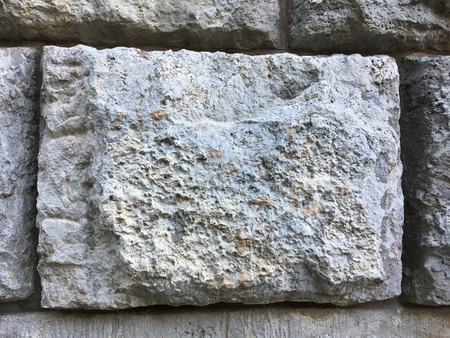 Grey Big Brick of Stone Wall Texture on ancient historic buildingの写真素材