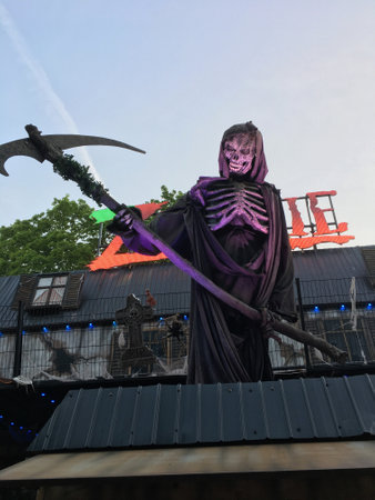 BERLIN - May 17, 2017: Spooky Skeleton with a Scythe - Ghost Train Puppet/Animatronic on German Funfairのeditorial素材