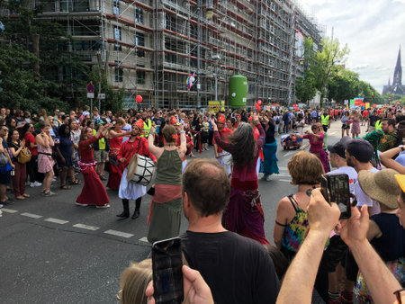 Berlin, Germany - June 9, 2019: Crowd attending the Carnival of Cultures Parade (Karneval der Kulturen Umzug) - a multicultural music festival in Kreuzberg in sunny weatherのeditorial素材
