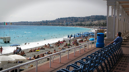 Nice, France - September 02, 2011: People sun bathing on the beach at Nice in France, Cote d'Azur and Mediterranean sea in summerのeditorial素材