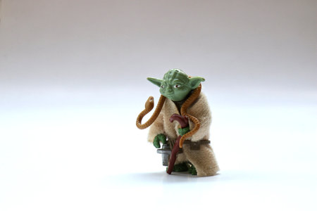 BERLIN - AUGUST 29, 2019: Vintage Star Wars Yoda Action Figure from Kenner Toys with Snake on White. This was released with the Movie "The Empire Strikes Back.のeditorial素材