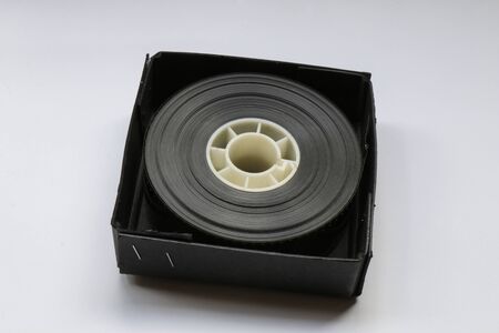 Small 35mm Movie Trailer Film Roll on a Bobby in a box. This is a 2-3 minute long film strip shipped to a Movie Theatre.の写真素材