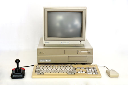 BERLIN - SEPTEMBER 06, 2019: Classic Commodore Amiga 2000 PC with Monitor 1084S, Competition Pro Joystick and Mouse. It was a famous Gaming PC in the Eightiesのeditorial素材