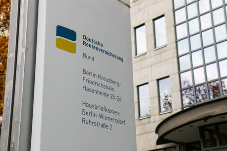 BERLIN - NOVEMBER 8, 2018: Sign of Deutsche Rentenversicherung / Pension Insurance in Kreuzberg in fallのeditorial素材