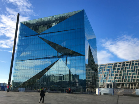 BERLIN - JANUARY 21, 2020: Cube Berlin, a modern and futuristic office building next to Central Station at Washingtonplatz. Part of Europacity. City and sky reflecting in the glass facade.のeditorial素材